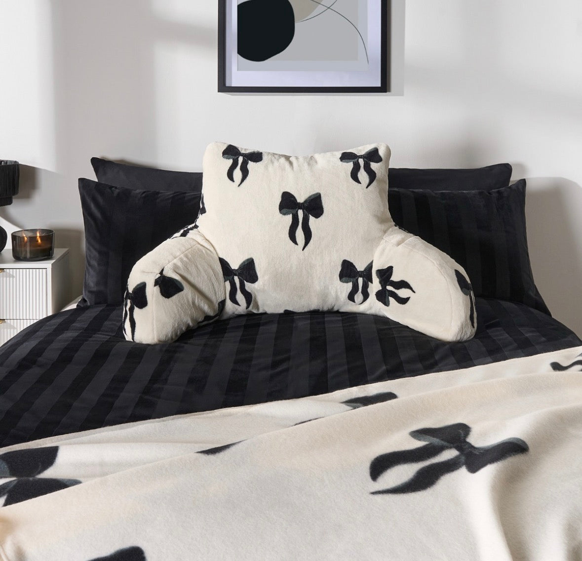 Bow cuddle cushion